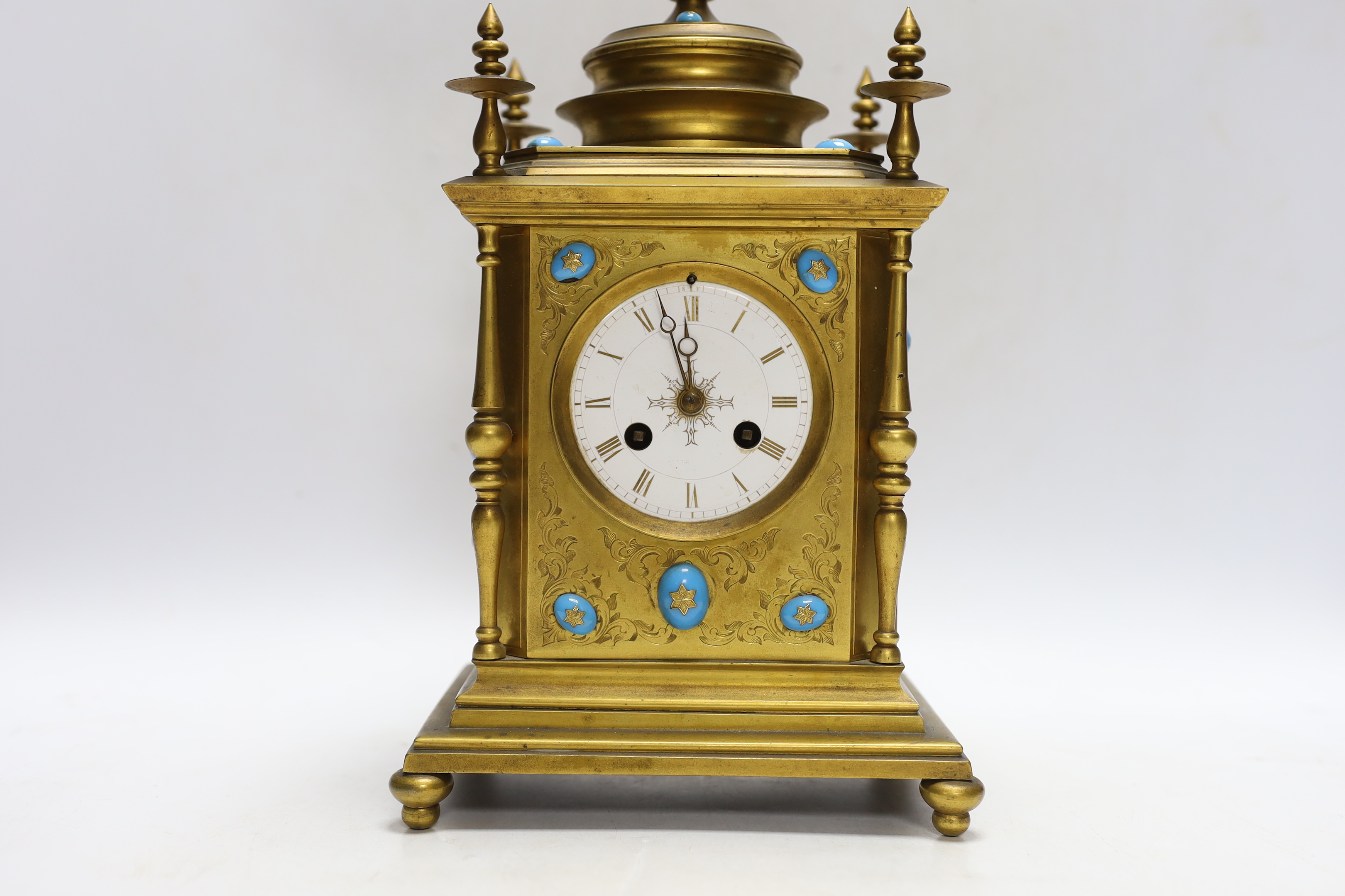 A brass French mantel clock (missing bell and pendulum), 35cm high
